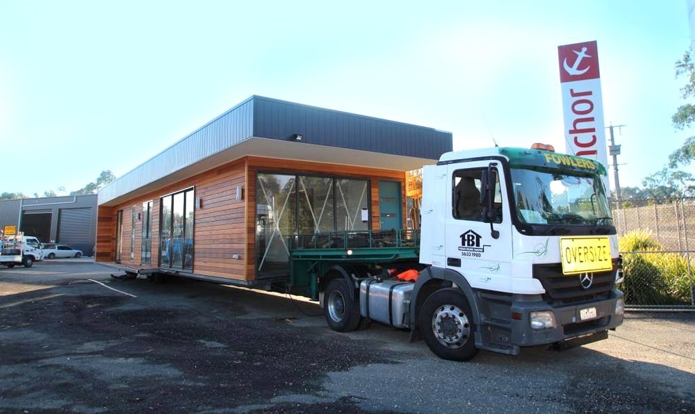 modaular home in transport 1.jpg